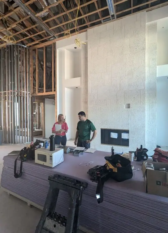 Kodama owner Tony Cirranello meets with a client at a job site